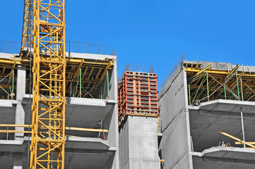 Obraz na płótnie Canvas Crane and highrise construction site