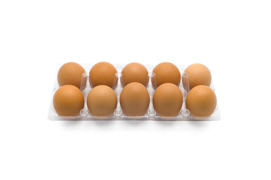 Eggs in clear plastic tray isolated on white background