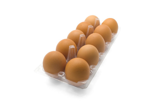 Eggs in clear plastic tray isolated on white background