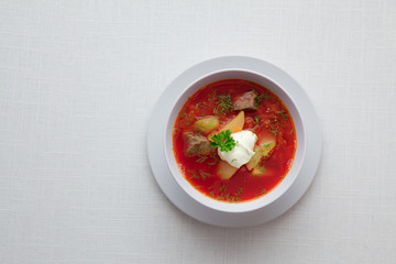 close up view of nice yummy red russian soup on white back