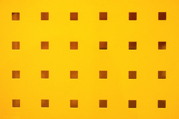yellow coated metal plate with the rectangular hole pattern