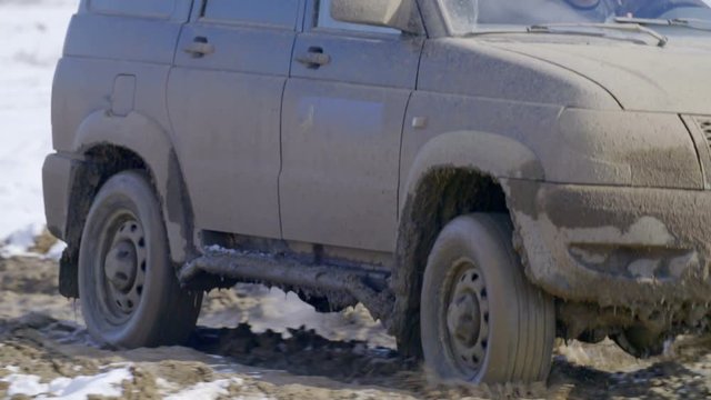 SUV driving on dirt road