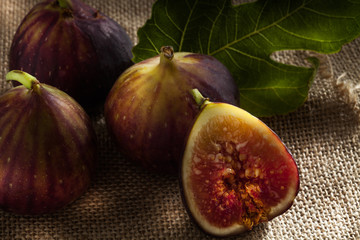 close up view of fresh figs on color back