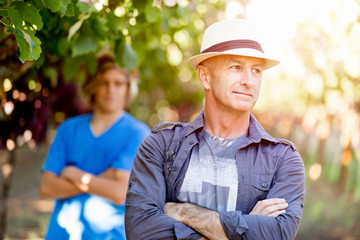 Father and son in vineyard