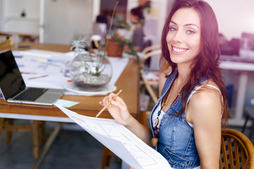 Young woman standing in creative office