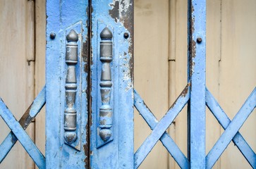 Blue steel door handles of the old sliding door (door, handle, vintage) 
