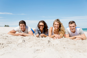 Fototapeta premium Company of young people on the beach