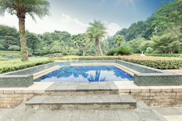 swimming pool in back yard of holiday totel