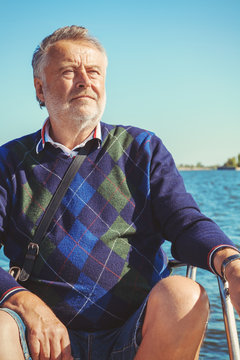 Elderly Man On Yacht At Sea