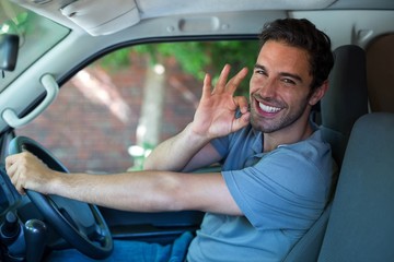 Portrait of happy man with ok sign