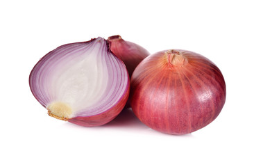 whole and half cut red onion, shallots on white background
