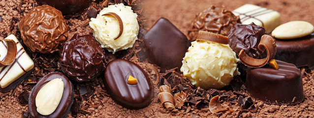 a chocolate background with pralines