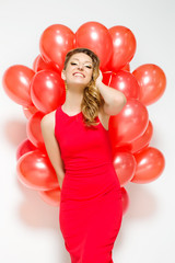 Lady in red dress with balloons