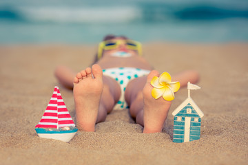 Fototapeta na wymiar Child relaxing on the beach