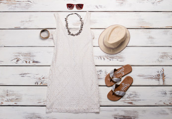 Lace dress and flip-flops.