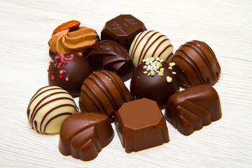 An assortment of fine chocolates in white, dark, and milk chocol