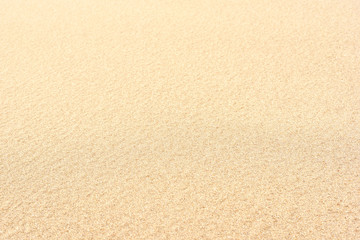Selective focus of sand on the beach. Close-up of sand with copy space. Focus on the foreground. Sand background.