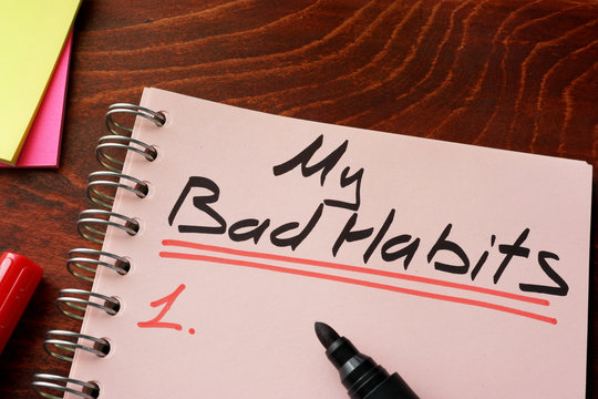 My bad habits written on a notepad. Motivation concept.