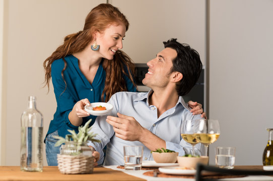 Couple eating at home