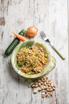 barley risotto with zucchinis carrots and pistachio nut