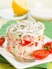 Russian cake salad with mayonnaise and tomatoes gulas