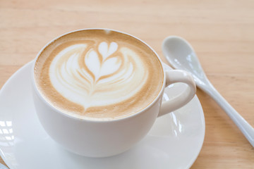 Latte Coffee art on the wooden table