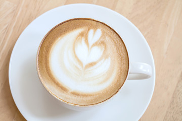 Latte Coffee art on the wooden table