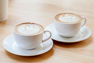 Latte Coffee art on the wooden table