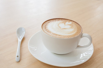 Latte Coffee art on the wooden table