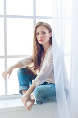 High key photo of a beautiful and glamorous young woman