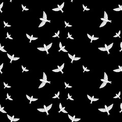 Seamless pattern with white birds on black background