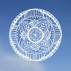 Mandala symbol on the sky background