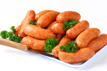 Pile of pork sausages on plate