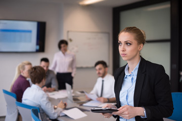 business woman working on tablet at meeting room