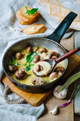 Melting mozzarella in pan with mushrooms, basil and garlic croutons