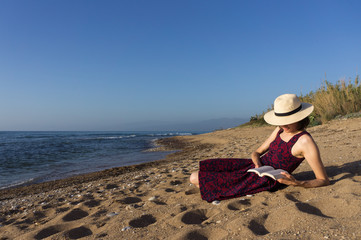 Woman reading on the beach