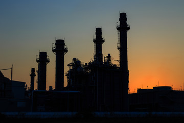 Fototapeta na wymiar Gas turbine electrical power plant after sunset at dusk