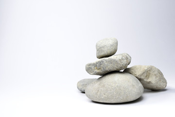 Stone stack, isolated on white background. Stones with copy space