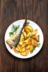 Baked potato wedges and mackerel fish