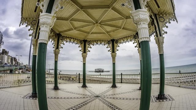 Time lapse fish eye view of the Victorian bandstand and the remains of the destroyed West pier in Brighton and Hove (UK)