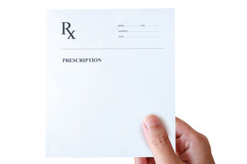 hand holding prescription rx paper