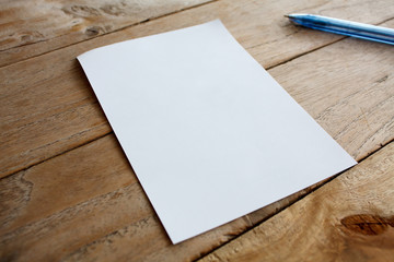 Blank paper on wood table - Powered by Adobe