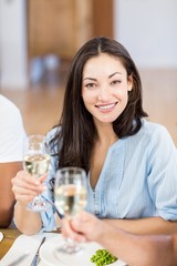 Obraz na płótnie Canvas Young woman holding a glass of wine