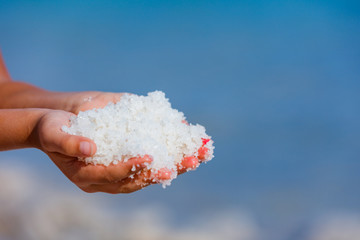 Hands with salt Dead Sea