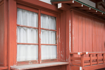 Obraz na płótnie Canvas glass window on the old red house