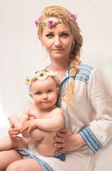 mother and baby girl with wreaths