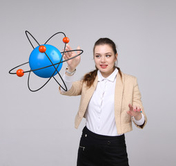 Woman scientist with atom model, research concept