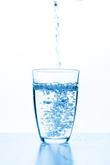 water splashing from glass isolated on white background