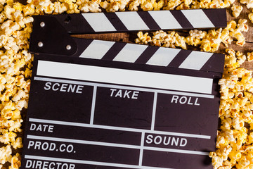 Movie clapper board and pop corn