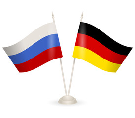 Table stand with flags of Russia and Germany. 